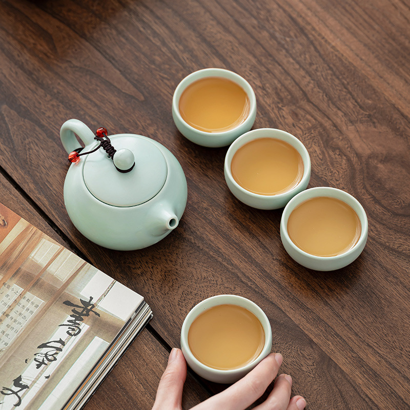 Bộ ấm trà du lịch gốm sứ tráng men - ảnh 3, nhìn từ trên xuống 4 chén đã rót trà